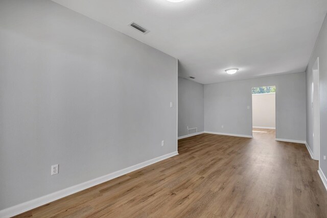 empty room with light hardwood / wood-style floors