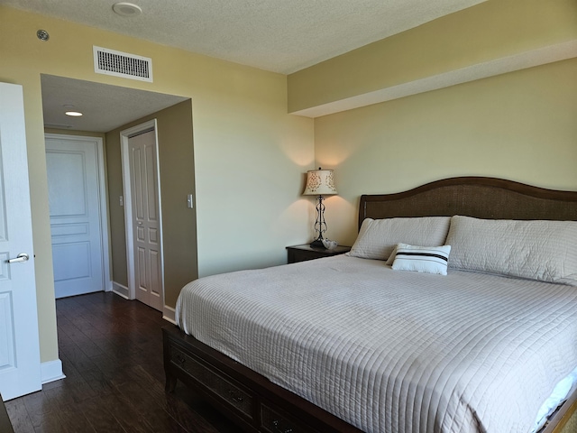 300 S Duval St Unit 1003, Tallahassee, FL 32301 - bedroom with baseboards, wood-type flooring, visible vents, and a textured ceiling