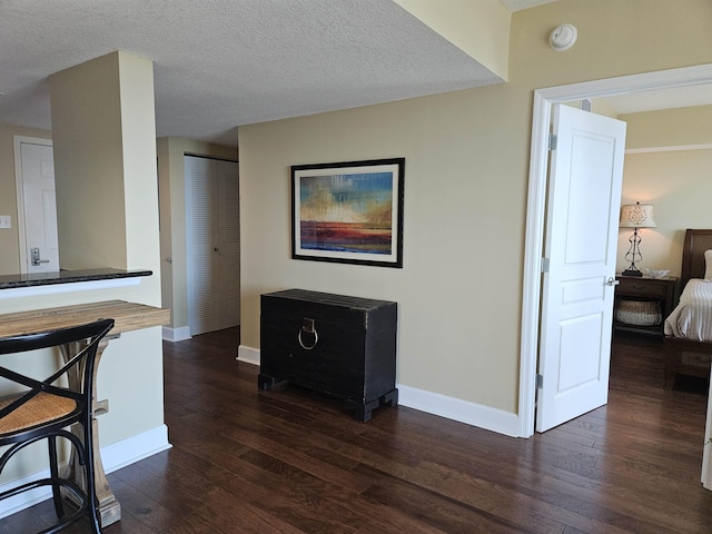300 S Duval St Unit 1003, Tallahassee, FL 32301 - interior space featuring a textured ceiling, baseboards, and dark wood-style floors
