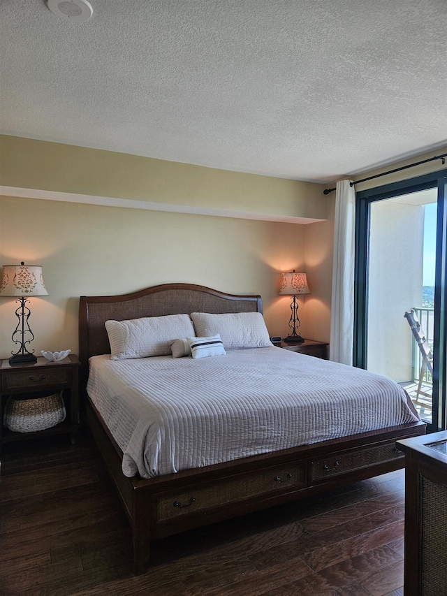300 S Duval St Unit 1003, Tallahassee, FL 32301 - bedroom with a textured ceiling, wood finished floors, and multiple windows