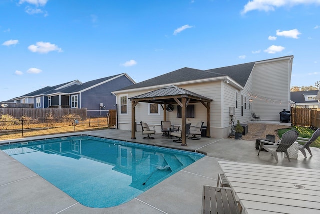 view of swimming pool featuring a gazebo and a patio