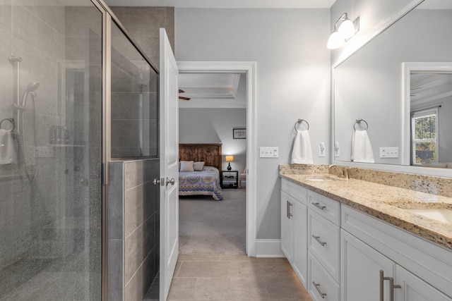 bathroom featuring ornamental molding, vanity, and a shower with door