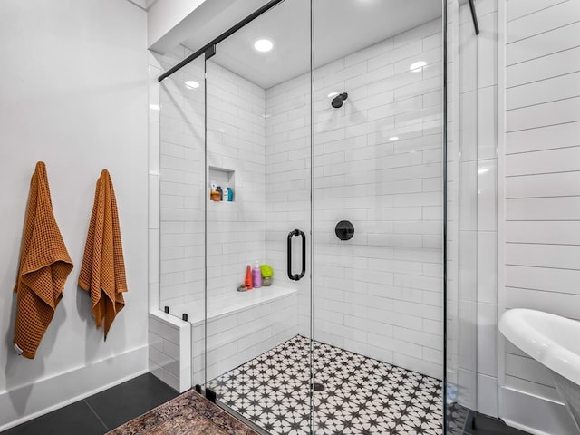 full bath with a shower stall and recessed lighting
