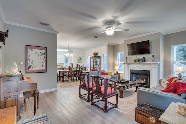 624 W 7th Ave Unit 1And 2, Tallahassee, FL 32303 - living area featuring ceiling fan, a fireplace, light wood-type flooring, a chandelier, and ornamental molding