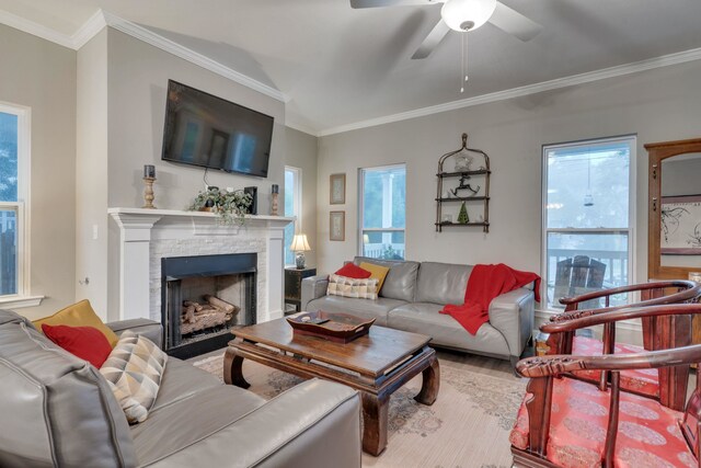 624 W 7th Ave Unit 1And 2, Tallahassee, FL 32303 - living room featuring a stone fireplace, a ceiling fan, ornamental molding, healthy amount of natural light, and wood finished floors