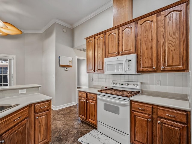 kitchen featuring light countertops, white appliances, and brown cabinetry