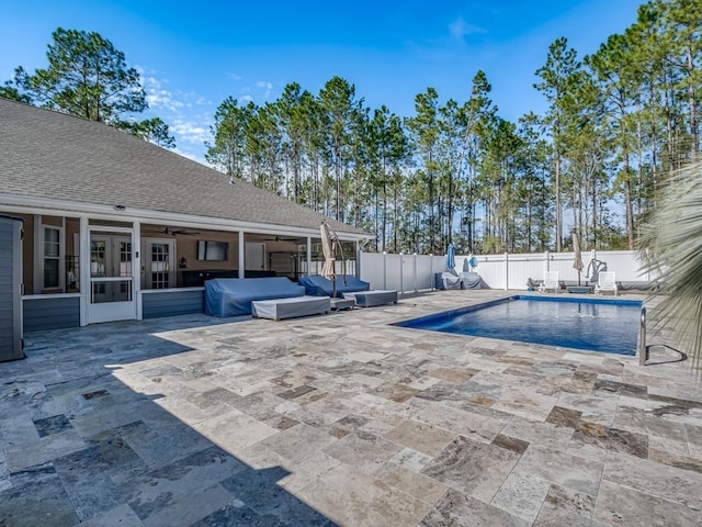 view of swimming pool featuring a patio, a fenced backyard, a fenced in pool, and a grill