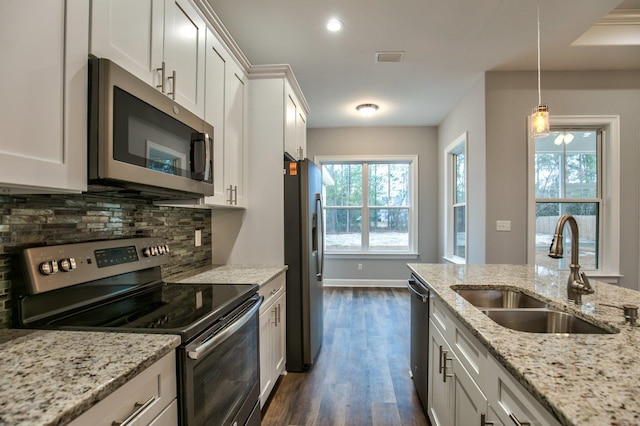 kitchen featuring sink, dark hardwood / wood-style flooring, white cabinets, and appliances with stainless steel finishes