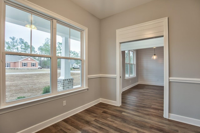 empty room with dark wood-type flooring