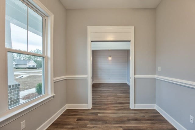 hallway featuring dark hardwood / wood-style floors