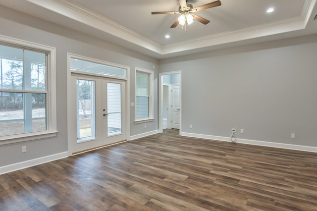 spare room featuring dark hardwood / wood-style flooring, a wealth of natural light, and french doors