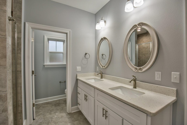 bathroom with walk in shower, vanity, and toilet