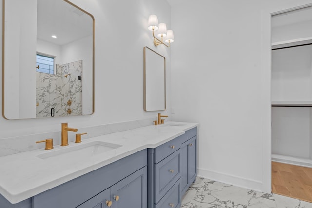 bathroom with vanity and a shower with shower door