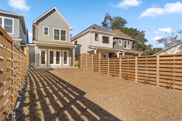 rear view of property with french doors