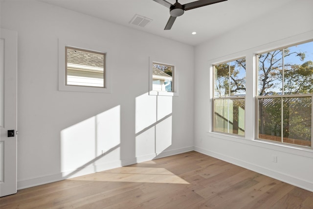 spare room with ceiling fan and light hardwood / wood-style floors