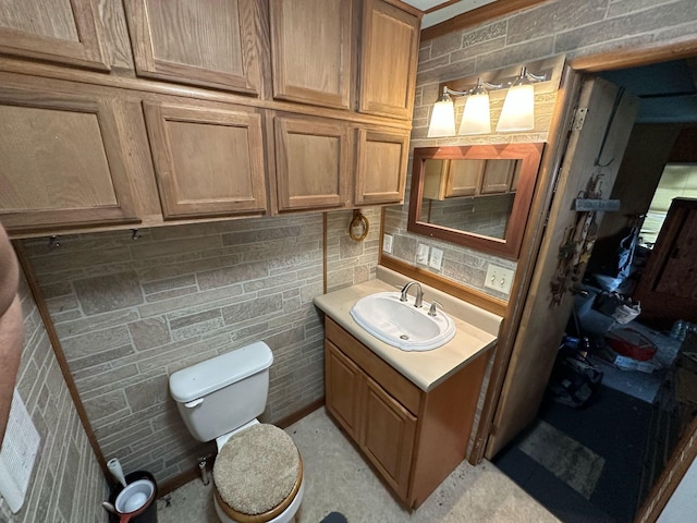 bathroom with toilet and vanity