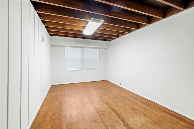 basement featuring wood-type flooring