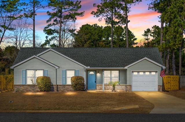 ranch-style home with a garage