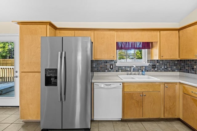 kitchen with stainless steel refrigerator with ice dispenser, dishwasher, sink, and decorative backsplash