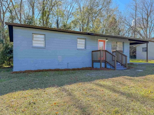 view of front of home with a front yard