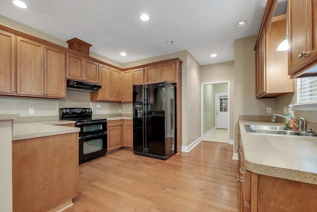 55 Hopkins Landing Rd, Quincy, FL 32351 - kitchen with black appliances, a sink, under cabinet range hood, light wood-style flooring, and light countertops