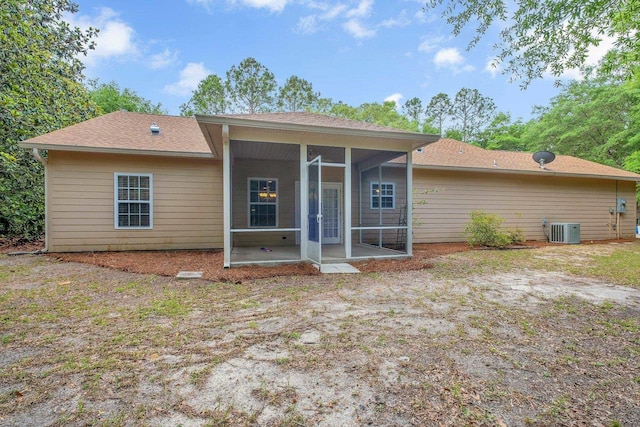 55 Hopkins Landing Rd, Quincy, FL 32351 - back of property with a sunroom, cooling unit, and a shingled roof