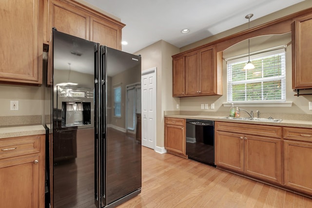 55 Hopkins Landing Rd, Quincy, FL 32351 - kitchen with black appliances, a sink, light wood finished floors, brown cabinets, and recessed lighting