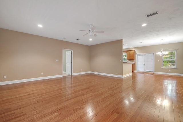 55 Hopkins Landing Rd, Quincy, FL 32351 - unfurnished living room featuring a chandelier, ceiling fan, light wood-type flooring, baseboards, and recessed lighting