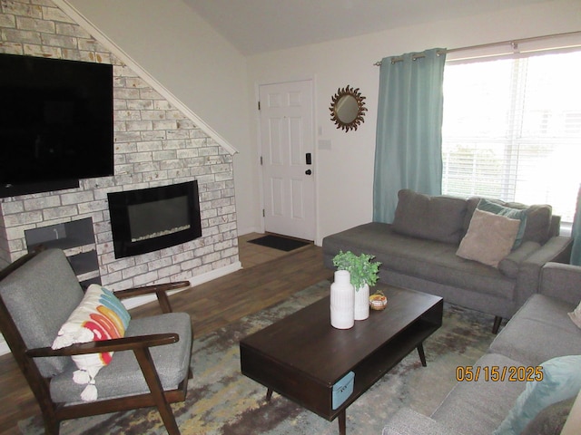 2738 W Tharpe St Unit 2101, Tallahassee, FL 32303 - living area featuring wood finished floors and a brick fireplace