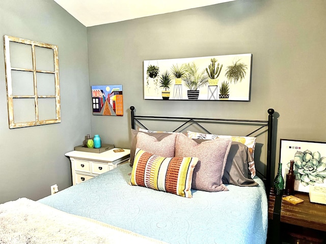 bedroom featuring vaulted ceiling