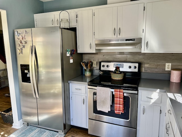 kitchen featuring exhaust hood, dark hardwood / wood-style floors, white cabinets, stainless steel appliances, and backsplash