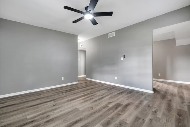 1722 Eisenhower St, Tallahassee, FL 32310 - unfurnished room with ceiling fan, wood finished floors, and baseboards