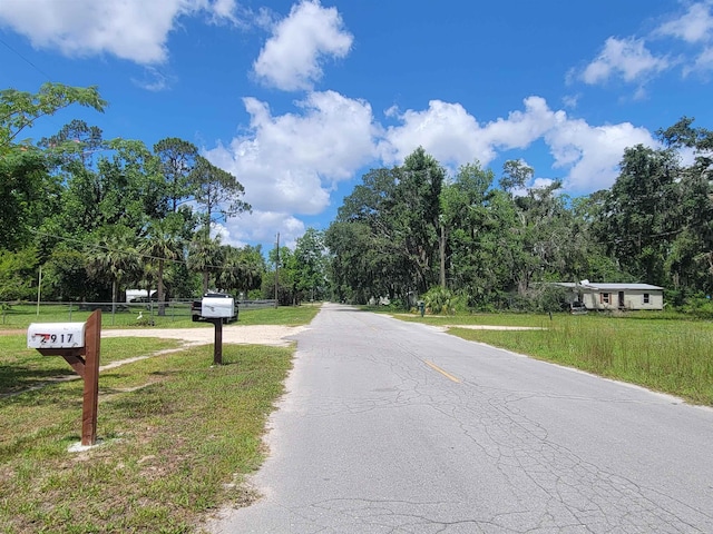 2917 Glover Carlton Rd, Perry, FL 32348 - view of asphalt street with view of wooded area