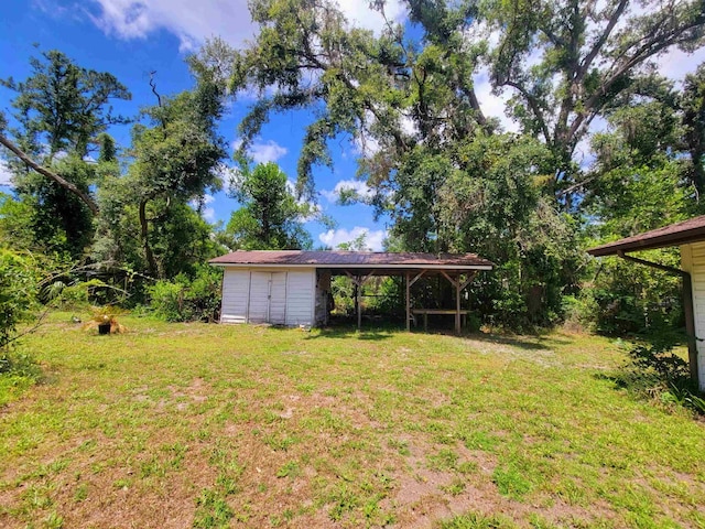 2917 Glover Carlton Rd, Perry, FL 32348 - view of grassy yard featuring an outdoor structure