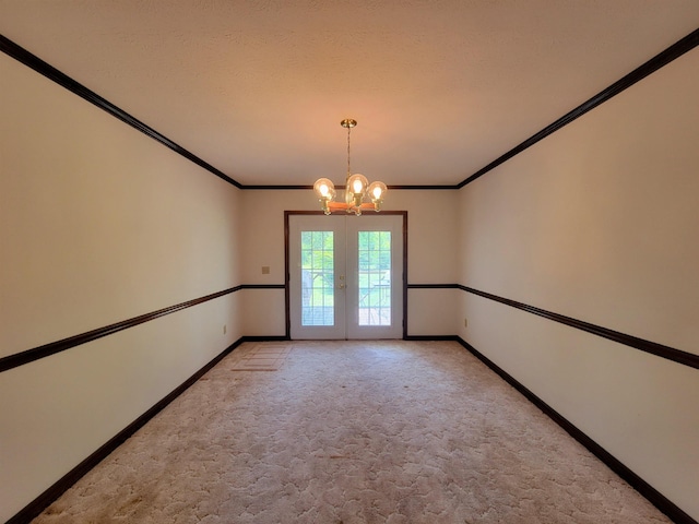 2917 Glover Carlton Rd, Perry, FL 32348 - unfurnished room with french doors, a chandelier, baseboards, light colored carpet, and ornamental molding