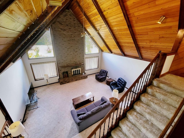 2917 Glover Carlton Rd, Perry, FL 32348 - living area featuring wooden ceiling, carpet floors, stairs, and a fireplace