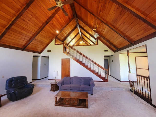 2917 Glover Carlton Rd, Perry, FL 32348 - carpeted living room featuring wooden ceiling with exposed beams, baseboards, a ceiling fan, high vaulted ceiling, and stairway