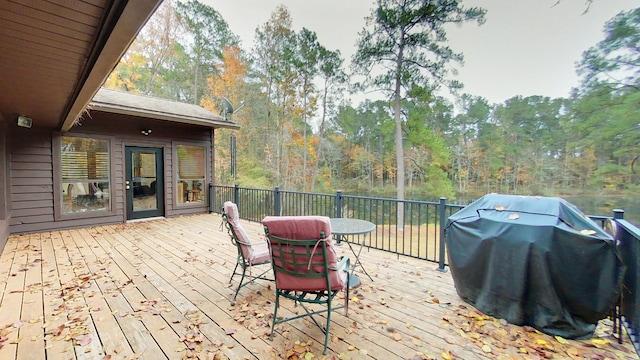 wooden deck with grilling area