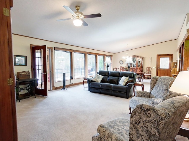 living room with ceiling fan and light colored carpet