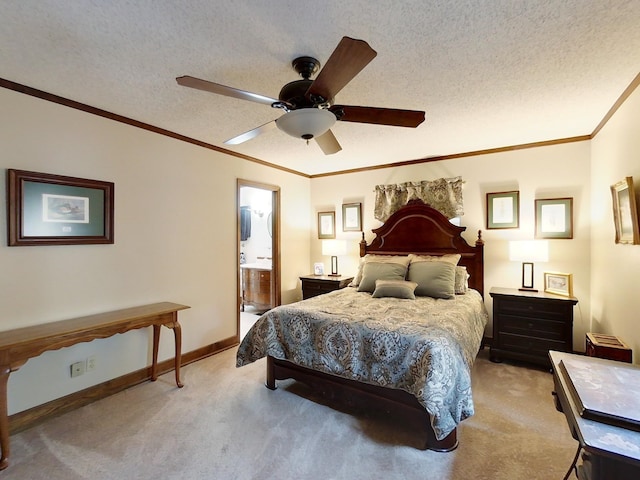 bedroom featuring ensuite bathroom, a textured ceiling, light colored carpet, ceiling fan, and crown molding