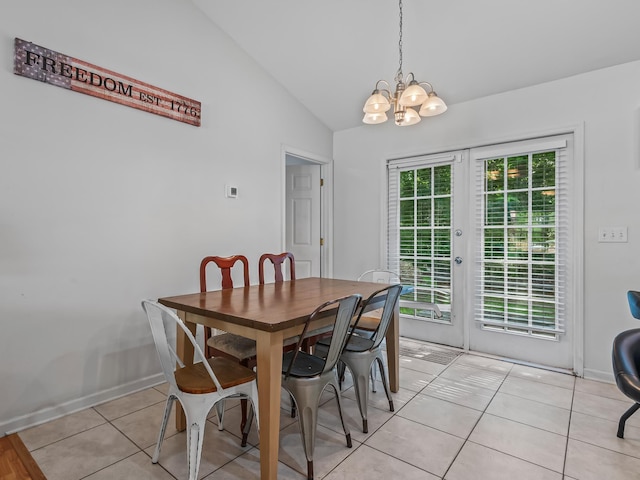 33 Paulette Dr, Crawfordville, FL 32327 - dining space featuring vaulted ceiling, light tile patterned floors, a chandelier, and french doors