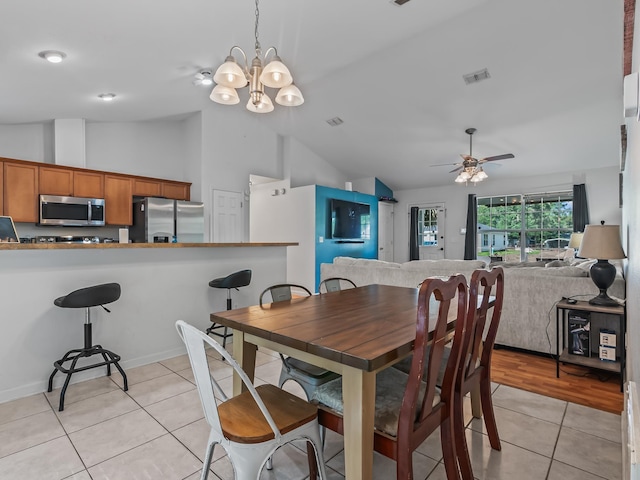 33 Paulette Dr, Crawfordville, FL 32327 - dining room featuring lofted ceiling, light tile patterned floors, ceiling fan, and a chandelier