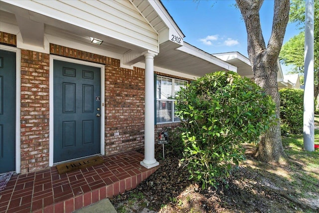 2738 W Tharpe St Unit 2302, Tallahassee, FL 32303 - property entrance with brick siding and a porch