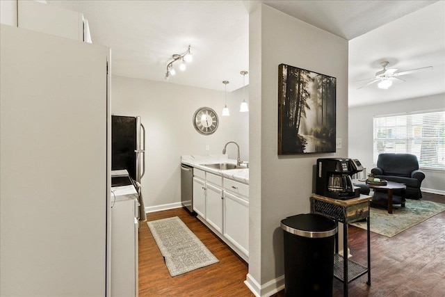2738 W Tharpe St Unit 2302, Tallahassee, FL 32303 - kitchen featuring dark wood finished floors, ceiling fan, stainless steel appliances, and white cabinetry