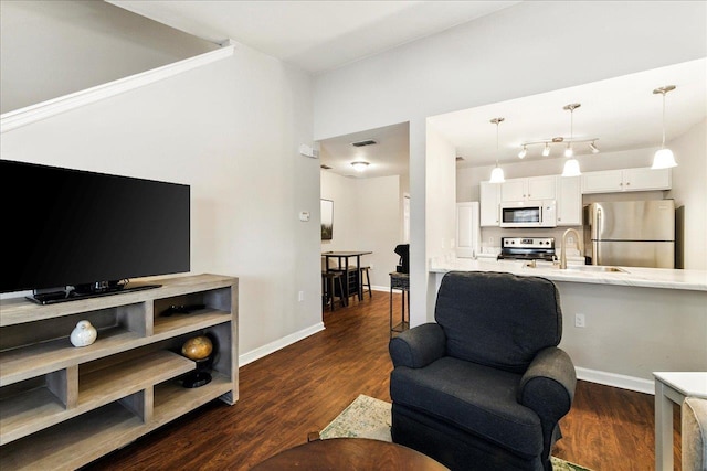 2738 W Tharpe St Unit 2302, Tallahassee, FL 32303 - living room featuring dark wood finished floors and baseboards