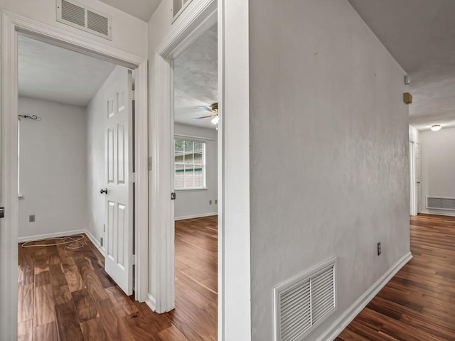 hall with dark wood-type flooring