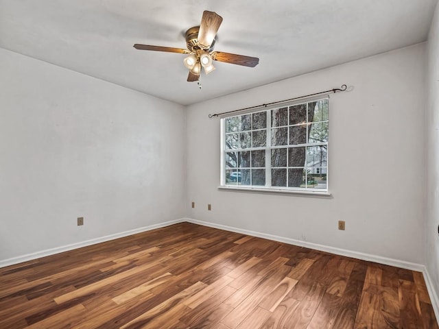 empty room with hardwood / wood-style flooring and ceiling fan