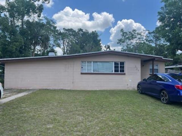 212 Susan St, Perry, FL 32348 - view of side of home featuring a lawn