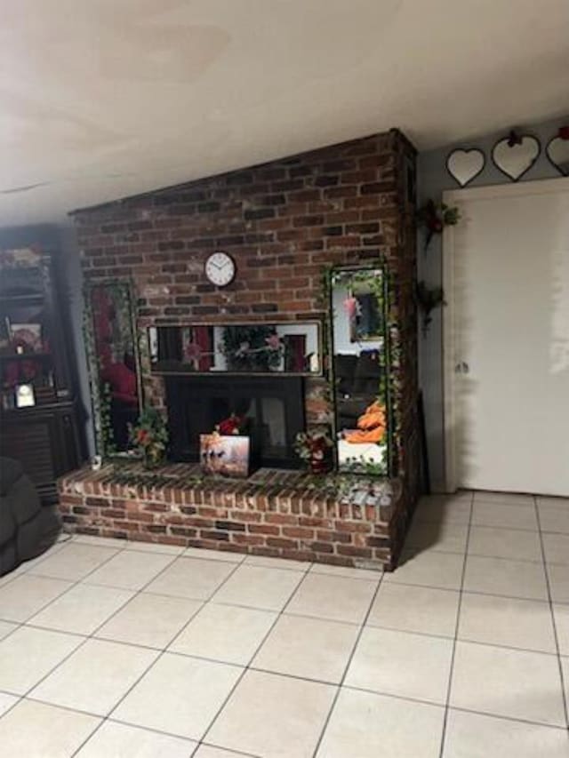 212 Susan St, Perry, FL 32348 - living area featuring tile patterned floors and a brick fireplace