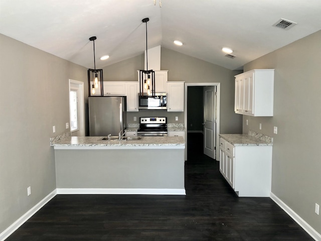 kitchen featuring appliances with stainless steel finishes, sink, pendant lighting, kitchen peninsula, and white cabinets